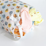 Bumkins Extra Large Wet Bag: Winnie + Friends with colorful baby clothes spilling out on a white background.