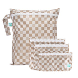 The Bumkins Wet Bag + Clear Travel Bag 3 Pack Set in Sand Check is perfect for travel organization or as a stylish gift.