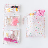 Bumkins The Chaos Coordinator Essential 4-Piece Set: Disney Princess Magic holds toiletries and swimwear on a white background.