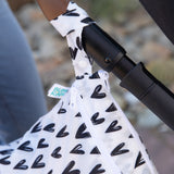 Close-up of the Bumkins Wet Bag + Wet/Dry Bag Set: Hearts, hanging from a stroller—stylish and perfect for essentials.