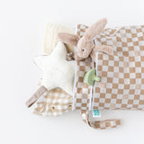 Bumkins Wet Bag + Wet/Dry Bag Set in Sand Check with essentials peeking out on a white background.