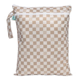 Bumkins Wet/Dry Bag: Sand Check is waterproof with two zippered compartments and a handle, ideal for organizing travel essentials.