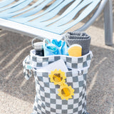 The Bumkins Wet Bag + Wet/Dry Bag Set in Charcoal Check keeps your summer essentials like goggles and sunscreen dry by the pool.