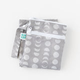 The Bumkins Wet Bag + Wet/Dry Bag Set: Lunar Phase is waterproof and reusable—ideal for packing with a moon phase pattern.