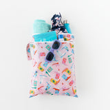 The Bumkins Wet Bag + Wet/Dry Bag Set: Boots neatly holds essentials like sunglasses, towel, bottle, and swimsuit.