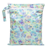 Bumkins Wet/Dry Bag: Aloha Stitch features tropical Stitch illustrations with guitars, leaves, and pineapples on waterproof fabric.