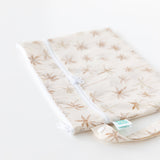 Bumkins Wet/Dry Clutch: Palm Daze rests on a white background, with focus on the zipper closure and side strap.