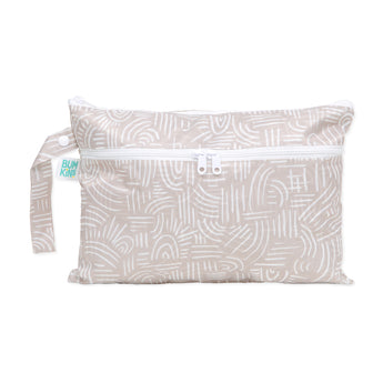 Bumkins Wet/Dry Clutch: Wander in beige with white abstract lines, a side strap, and waterproof fabric; ideal for wet/dry use.