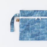 Roamio by Bumkins Wet/Dry Clutch: Crushed Denim lays flat on a white background.