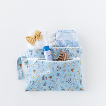 A bag from Bumkins On-The-Go Mealtime 5-Piece Set: Mickey + Minnie Mouse Sunny Side Up Pink holds baby essentials on a white background.