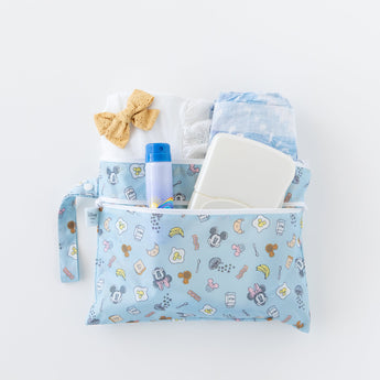 Bumkins Wet/Dry Clutch: Mickey + Minnie Sunny Side Up stores diapers, wipes, clothes, and sunscreen on a white background.