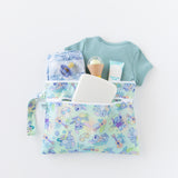 Bumkins Wet/Dry Clutch: Aloha Stitch holds clothes, diapers, and baby essentials on a white background.