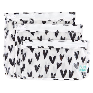 Bumkins Clear Travel Bag 3-Pack: Hearts includes 3 TSA-compliant pouches made of white waterproof fabric with black hearts.