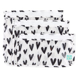 Bumkins Clear Travel Bag 3-Pack: Hearts includes 3 TSA-compliant pouches made of white waterproof fabric with black hearts.
