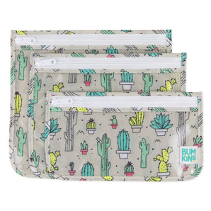Bumkins Clear Travel Bag 3-Pack: Cacti includes 3 TSA-compliant pouches with cactus illustrations on gray waterproof fabric.