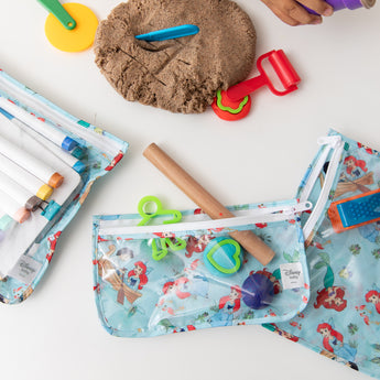 Bumkins Clear Travel Bag 3 Pack: Disney Princess Ariel with kinetic sand, cookie cutters, and markers on a white background.