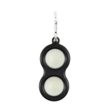 The Simpl Dimpl by Fat Brain Toy Co features a black, peanut shape with glow-in-the-dark covers and a metal clip for tactile fun.