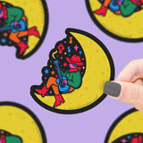 Turtle Soups Space Cowboy vinyl sticker: Enjoy a cowboy playing guitar on a crescent moon, surrounded by notes. Durable and vibrant!.