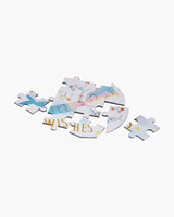 Floss and Rocks 80 Piece Puzzle, Fantasy: partially assembled with cartoon clouds, stars, and WISHES on a white background.