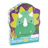 Floss and Rocks 12 Piece Dinosaur Puzzle features a green dinosaur on purple, ideal for enhancing hand-eye coordination.