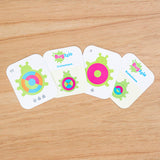 Bugzzle Game by Fat Brain Toy Co features four colorful, circular-patterned cards titled Buggzle and Solution for a brain challenge.
