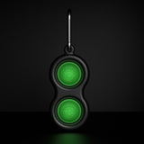 The Simpl Dimpl by Fat Brain Toy Co is a black keychain with glow-in-the-dark green cloud buttons perfect for tactile play.