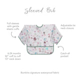 Infographic of Bumkins Sleeved Bib: Bumkins signature waterproof fabric, catch-all pocket, adjustable tie neck closure, 6-24 months.