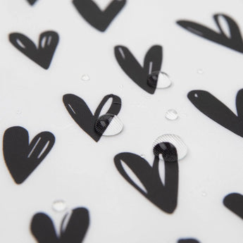 Close-up of water droplets on Bumkins Wet/Dry Bag: Hearts.