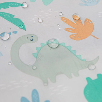 Close-up of water droplets on Bumkins Sleeved Bib: Dinosaurs.