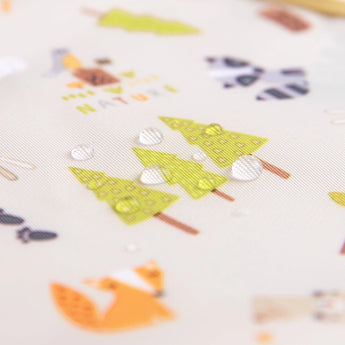 Close-up of water droplets on a Bumkins SuperBib® 3 Pack: Happy Campers.