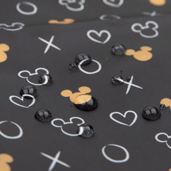 Close-up of water droplets on a black Bumkins SuperBib® 3 Pack: Love, Minnie.
