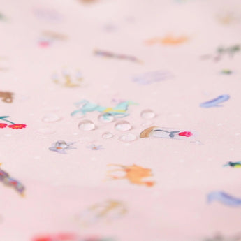 Close-up of water droplets on Bumkins Splat Mat: Princess Magic.
