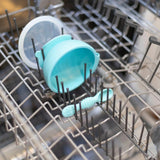 Bumkins Silicone First Feeding Set: Blue sits in the top rack of an open dishwasher.