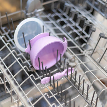 Bumkins Silicone First Feeding Set: Lavender sits in the top rack of an open dishwasher.
