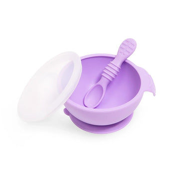 Bumkins Silicone First Feeding Set: Lavender includes a bowl with suction bottom, a matching spoon, and a transparent lid.