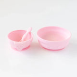 Bumkins Silicone First Feeding Set: Pink sits next to a larger pink bowl on a white background.