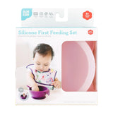 Bumkins Silicone First Feeding Set: Pink is shown in a white packaging box, with a clear window partially showing the bowl.