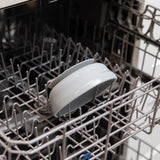 Bumkins Silicone Grip Bowl: Gray sits in the top rack of an open dishwasher.