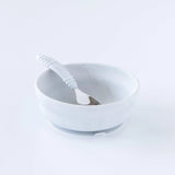 Bumkins Silicone Grip Bowl: Marble holds a matching spoon on a white background.