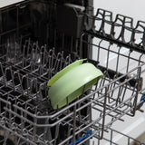 Bumkins Silicone Grip Bowl: Sage sits in the top rack of an open dishwasher.