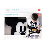 Bumkins Silicone Grip Dish: Mickey Mouse in a white packaging box with a photo of a child and a clear window partially displaying the dish.