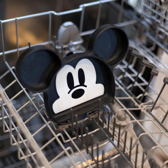 Bumkins Silicone Grip Dish: Mickey Mouse sits in the top rack of an open dishwasher.