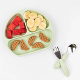 Bumkins Silicone Grip Dish: Sage holds watermelon, banana slices, and waffles on a white background, with matching utensils nearby.