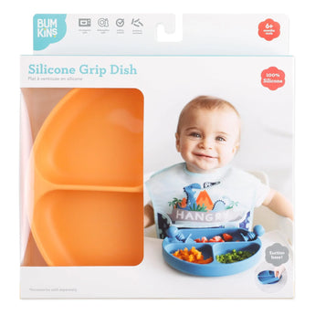 Bumkins Silicone Grip Dish: Tangerine in a white packaging box with a photo of a child and a clear window partially displaying the dish.