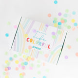 A colorful gift box for Bumkins Ultimate Gift Set - Ocean Life & Whale Tail surrounded by confetti on a white background.