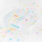 A colorful gift box for Bumkins Ultimate Gift Set - Ocean Life & Whale Tail surrounded by confetti on a white background.