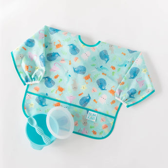 A whale-themed sleeved bib, blue bowl, blue spoon, and lid from Bumkins Ultimate Gift Set - Ocean Life & Whale Tail on a white background.
