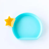 Bumkins Silicone Grip Plate: Blue with a yellow star-shaped silicone container hanging from the edge on a white background.