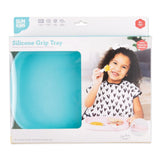 Bumkins Silicone Grip Tray: Blue in a white packaging box with a photo of a child and a clear window partially displaying the dish.