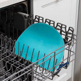 Bumkins Silicone Sensory Placemat: Blue sits in the top rack of an open dishwasher.